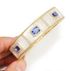 Triple Tanzanite Gold Bangle with Diamonds in Mother of Pearl